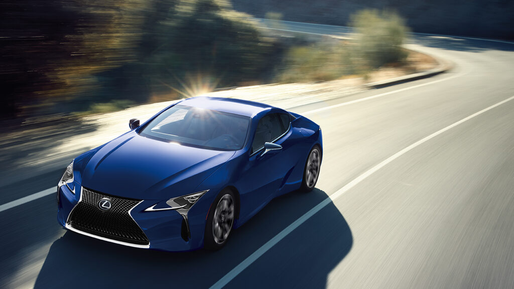 Lexus LC 500h in blue on a winding road