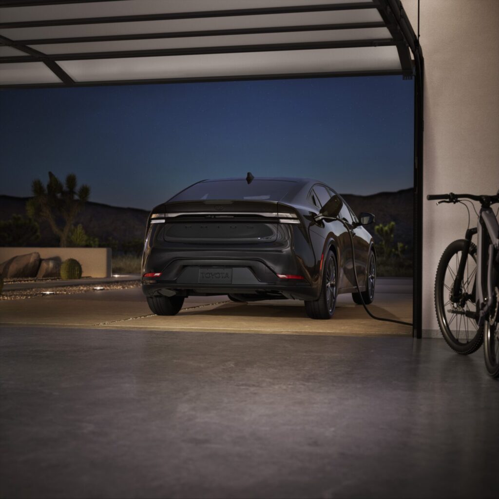 Toyota Prius Plug-in Hybrid Nightshade Edition charging in a garage