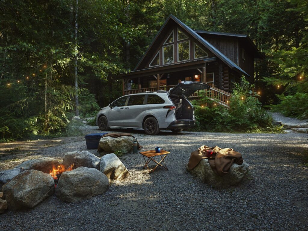 2026 Toyota Sienna Woodland parked by a cabin