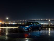 Toyota Camry XLE in Ocean Gem at night by a bridge