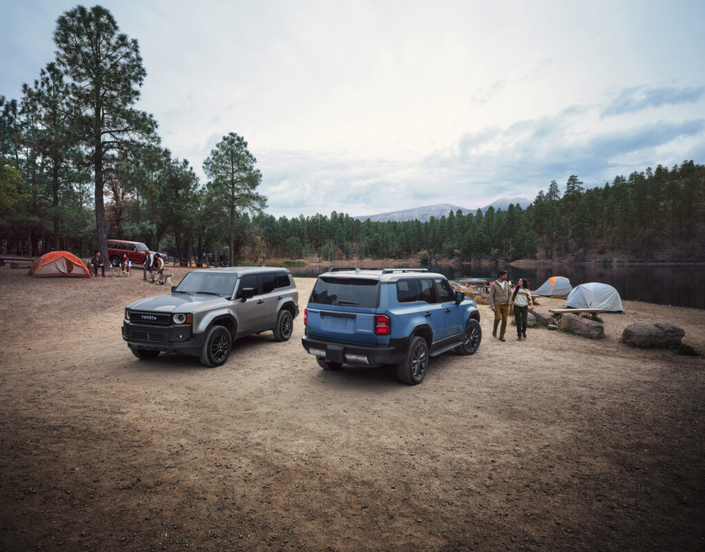 Two 2027 Toyota Land Cruisers at a campsite